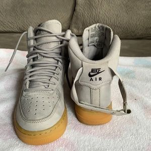 Light gray high top Nike sneakers